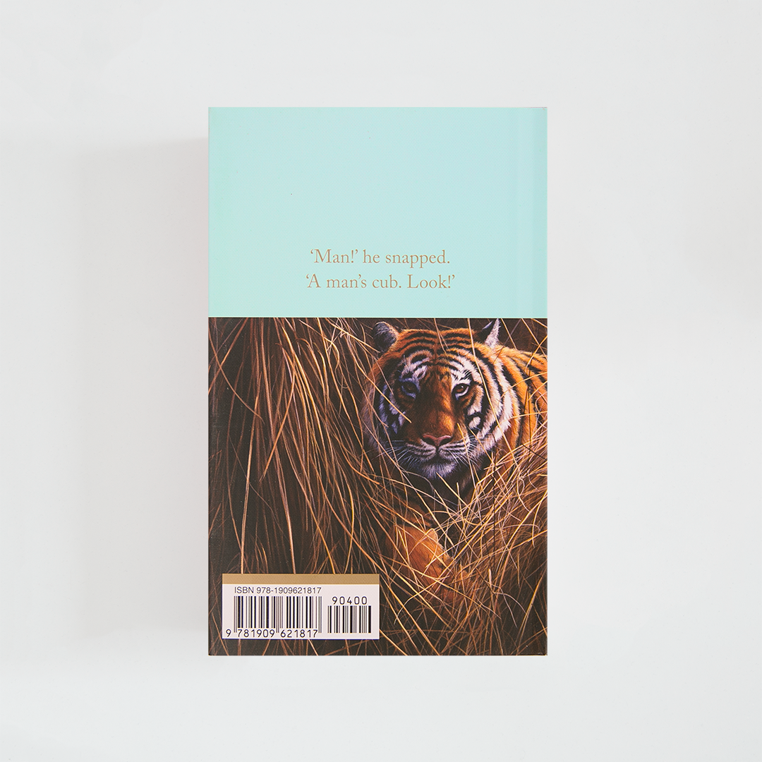 Trasera del libro The Jungle Book de Rudyard Kipling (The Collector's Library) de color celeste acompañada de imagen inspirada en la novela.