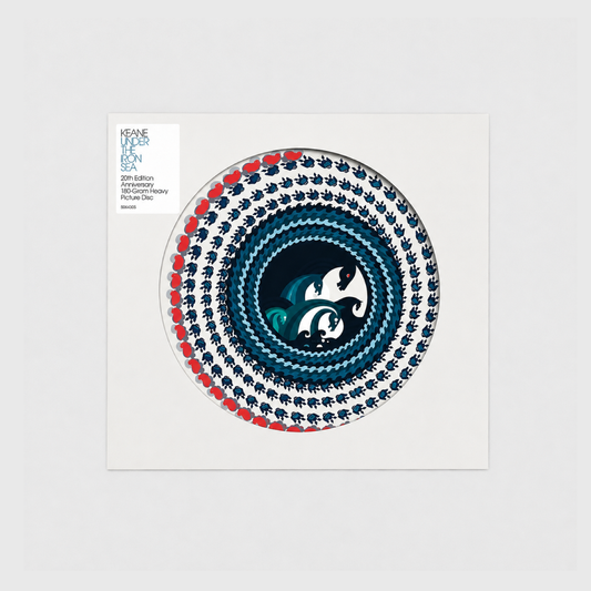 Edición 20.º aniversario de Under the Iron Sea de Keane en formato Picture Disc de 180 gramos, con funda blanca de apertura circular que deja ver el diseño ilustrado del vinilo y una etiqueta con la información de la edición especial.