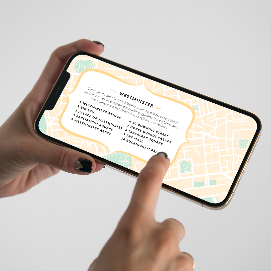 Chica señalando en el móvil el mapa de Westminster da de la guía digital de Londres Passport to London de Superbritánico.