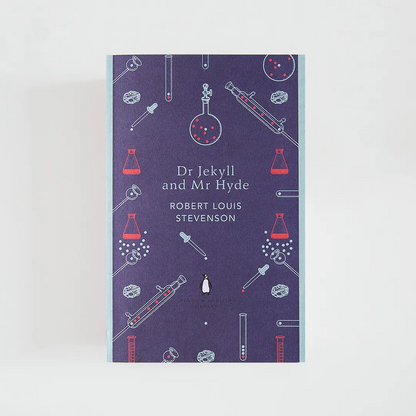 Portada morada y celeste del libro en inglés Dr Jekyll and Mr Hyde de Robert Louis Stevenson de la colección Penguin English Library sobre fondo blanco.

