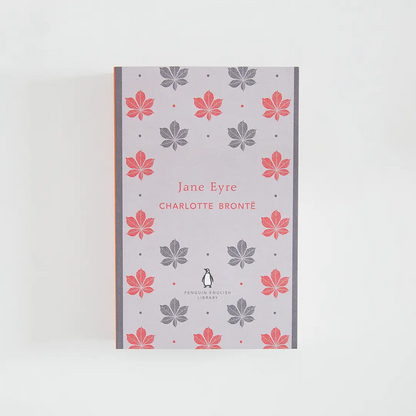Portada gris y roja del libro en inglés Jane Eyre de Charlotte Brontë de la colección Penguin English Library sobre fondo blanco.
