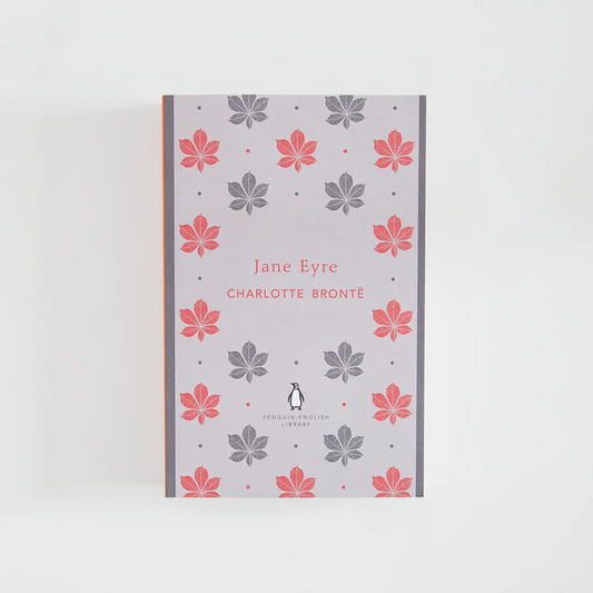 Portada gris y roja del libro en inglés Jane Eyre de Charlotte Brontë de la colección Penguin English Library sobre fondo blanco.
