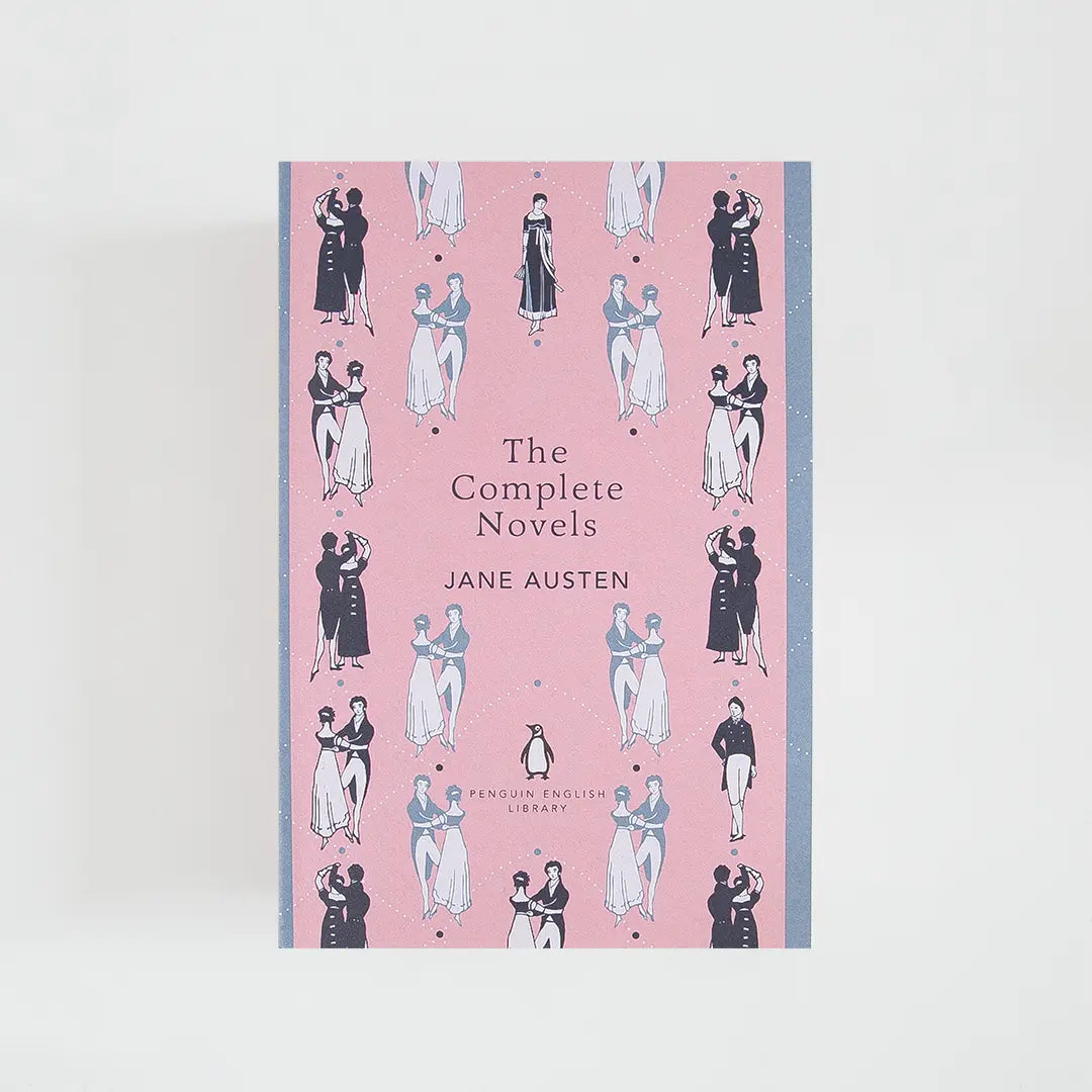Portada rosa y gris del libro en inglés The Complete Novels de Jane Austen de la colección Penguin English Library sobre fondo blanco.
