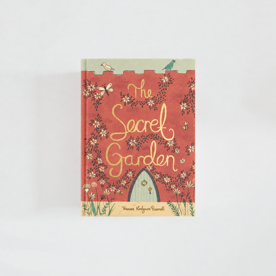 Portada de The Secret Garden de Frances Hodgson Burnett, edición Wordsworth Collector’s Editions, en coral con flores, mariposas y una puerta de jardín.