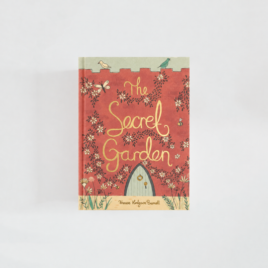 Portada de The Secret Garden de Frances Hodgson Burnett, edición Wordsworth Collector’s Editions, en coral con flores, mariposas y una puerta de jardín.