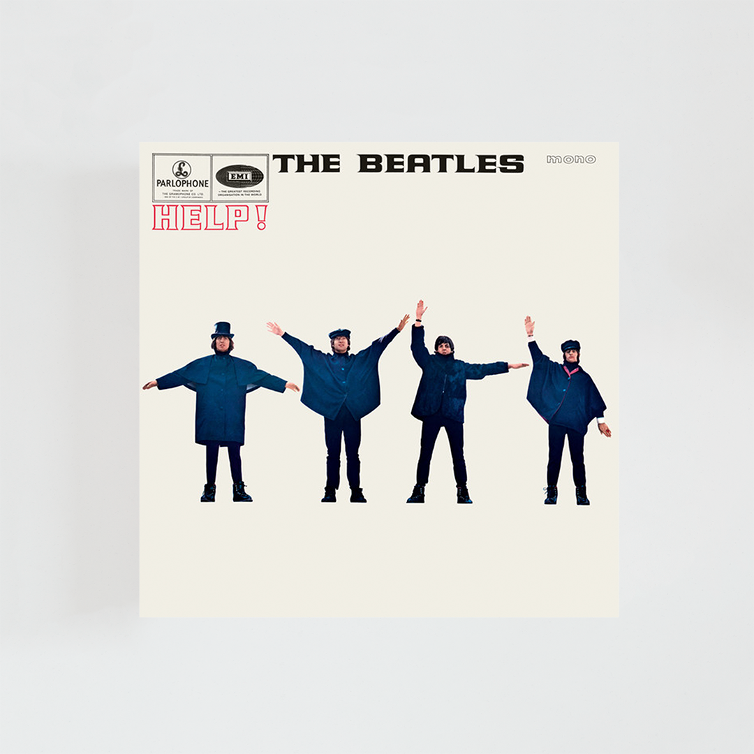 Portada del vinilo Help! de The Beatles, con los cuatro miembros de la banda posando con los brazos extendidos formando señales sobre un fondo azul, álbum clásico de rock británico de 1965.