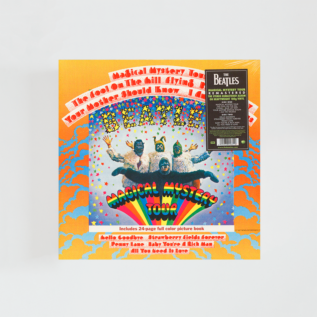 Portada del vinilo Magical Mystery Tour de The Beatles, con los cuatro miembros de la banda vestidos con trajes coloridos y extravagantes, frente a un fondo psicodélico, álbum clásico de rock británico de 1967.