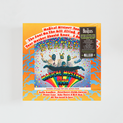 Portada del vinilo Magical Mystery Tour de The Beatles, con los cuatro miembros de la banda vestidos con trajes coloridos y extravagantes, frente a un fondo psicodélico, álbum clásico de rock británico de 1967.